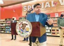  ?? JOHN O’CONNOR/AP ?? Gov. J.B. Pritzker defends his plan Tuesday to offer election-year tax relief to consumers on groceries, gasoline and property.
