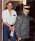  ?? CP FILE PHOTO ?? Allan Legere departs from court in Burton, N.B., on Nov. 2, 1991.