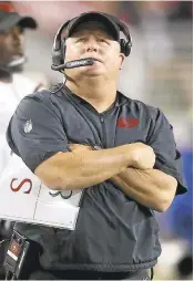  ?? JOSIE LEPE/STAFF ?? 49ers coach Chip Kelly looks at replay after a touchdown. Kelly admits he does not share Patriots’ coach Bill Belichick’s disdain for technology on the sidelines. Kelly has other things to worry about.