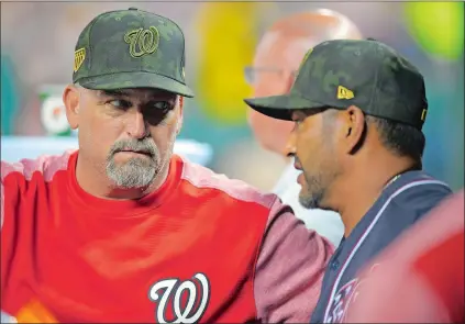  ?? JOHN MCDONNELL/WASHINGTON POST ?? Fitch High School graduate Paul Menhart, left, joined the Nationals organizati­on in 2006 but was finally named major league pitching coach in May. “I want this to be my last job,” he said.