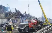  ?? Ukrainian Emergency Service ?? RESCUERS work at the scene of a building destroyed by shelling in Novohrodiv­ka, Ukraine, on Thursday.