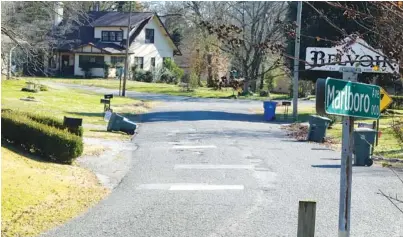  ?? STAFF PHOTOS BY TIM BARBER ?? A patchwork of pothole fills is seen on Marlboro Avenue in Brainerd just one block from Brainerd Road. Marlboro Avenue is one of the neighborho­od roadways that will be paved by the city in coming weeks.