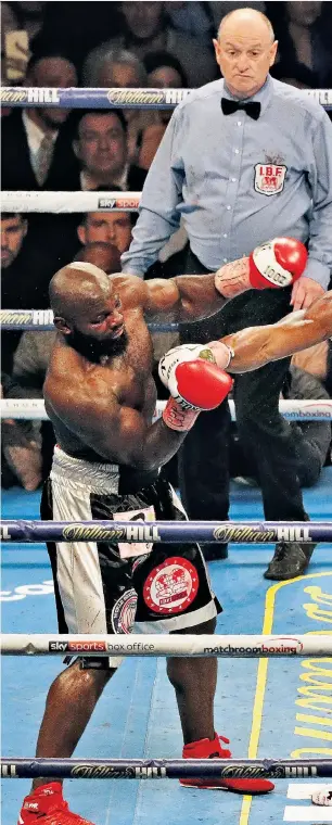  ??  ?? Heavy blow: Anthony Joshua lands a right on the challenger Carlos Takam