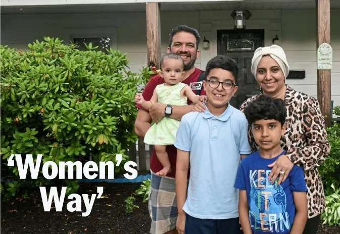  ?? Mattie Neretin/Post-Gazette ?? Marwa Alkhafaji with her husband, Mohammed, and their three children on Thursday at their home in Upper St. Clair. She is featured in a local film series.