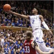  ?? CHRIS SEWARD - THE ASSOCIATED PRESS ?? Duke’s Cam Reddish (2) drives to the hoop against North Carolina State’s Wyatt Walker (33) during the second half of an NCAA college basketball game in Durham, N.C., Saturday, Feb. 16, 2019.