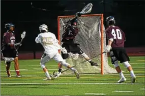  ?? MICHAEL REEVES — FOR DIGITAL FIRST MEDIA ?? Shanahan’s Gabriel Goforth (55) scores past Henderson goalie Kyle Dampman during Henderson’s win over Shanahan on Thursday.