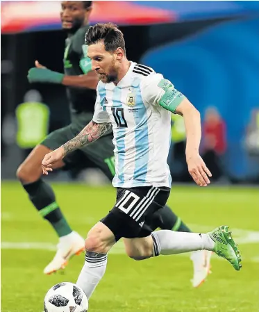  ?? Picture:MB Media/Getty Images ?? OUTTA MY WAY: Lionel Messi of Argentina in action during the 2018 FIFA World Cup Russia group D match against Nigeria at the Saint Petersburg Stadium