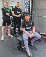  ?? ?? Oban Lorne Rugby Football Club captain Vasil Borisov, sitting, with vice-captain Jamie Bate, right, and team mate Robert McLaughlin, who have been supported through the Elite Squad programme at Atlantis.