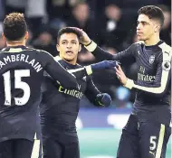  ?? AP ?? Arsenal’s Alexis Sanchez (centre) celebrates scoring his side’s fourth goal during the English Premier League match against at the Liberty Stadium, Swansea. Arsenal won 4-0.