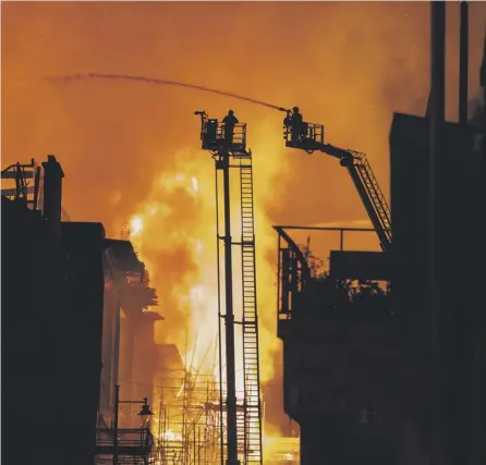  ??  ?? 0 Firefighte­rs battle to contain the fire that destroyed the Mackintosh building at Glasgow School of Art in June. Picture: John Devlin