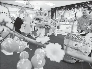  ??  DARREN BROWN/OTTAWA CITIZEN ?? Performers rehearse the ceremonial lion dance at the Pho Da Buddhist Temple in preparatio­n for Chinese New Year’s celebratio­ns. The New Year’s Eve dinner is also called Reunion Dinner, and certain foods are favourites because of their symbolic meanings.