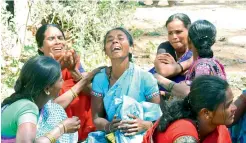  ?? — DC ?? Families mourn the demise of the workers in Chittoor on Friday.