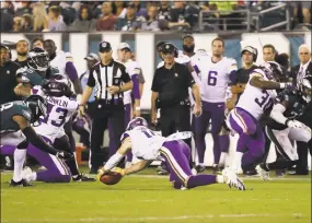  ?? Michael Perez / Associated Press ?? The Vikings’ Stefon Diggs recovers an onside kick during an Oct. 7 game against the Eagles.