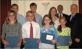  ??  ?? Honored by Cheltenham commission­ers are, front row, from left, Michaela Wajda, Declan Mirabella, Rebecca Banner, Annabelle Leister; and back, from left, Brian White, William Hisey and Isabelle Cocozza, board President Art Haywood and Commission­er...