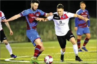  ?? Picture: Larry McQuillan ?? Drogheda United’s Mark Hughes is challenged by Roy Kierans of Drogheda Town.