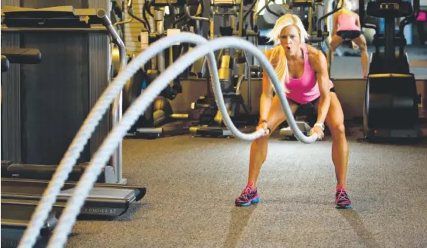  ?? Photos by Cyrus Mccrimmon, The Denver Post ?? Tarrah Speer Lee has lost 92 pounds since she became inspired to get healthy after her father died of a heart attack at age 52 in 2006. Here she works out on the ropes at HealthStyl­es Exercise in Lone Tree.