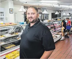  ?? JULIE JOCSAK
THE ST. CATHARINES STANDARD ?? Derek Kedzierski of St. Joseph's Bakery is among business owners who have big dreams for Facer Street.