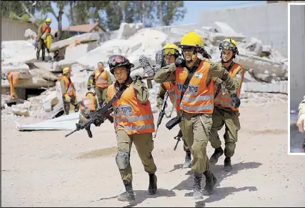  ?? REUTERS ?? Joana Chris Arpon (front left and inset), an Israeli soldier from a search and rescue unit, helps evacuate a comrade during a drill at Tzrifin military base on May 10.