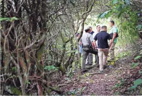  ??  ?? National Park Service and other federal officers investigat­e woman’s death along the Blue Ridge Parkway in July 2018.