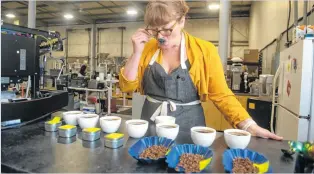  ?? RYAN TAPLIN • THE CHRONICLE HERALD ?? Liz Bishop, director of coffee at Java Blend, samples coffees at the company’s production facility in Dartmouth.