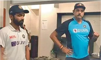  ??  ?? Indian coach Ravi Shastri (right) talks to players in the dressing room with captain Ajinkya Rahane by his side after India beat Australia to clinch the Border-Gavaskar Test series 2-1 at the Gabba in Brisbane on Tuesday.