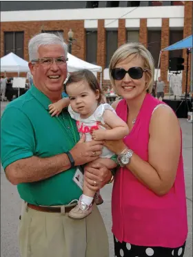  ?? SUBMITTED ?? Doug Lewis poses with his daughter Kendall and wife, Meghan, at a Painesvill­e event.