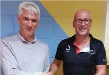  ??  ?? Paul Rutherford receives a cheque of €500 from Sligo Triathlon Club as he travels this week to Hawaii for the World Ironman Championsh­ips.