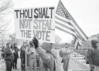  ?? ERIN SCHAFF/THE NEW YORK TIMES ?? Two weeks before President-elect Joe Biden’s inaugurati­on, supporters of President Donald Trump rally Jan. 6 outside the U.S. Capitol in Washington to protest the election results.