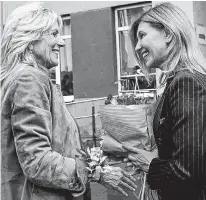  ?? SUSAN WALSH • REUTERS ?? U.S. first lady Jill Biden, left, meets with Olena Zelenska, wife of Ukraine's President Volodymyr Zelenskiy, outside a public school in Uzhhorod, Ukraine, Sunday.