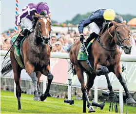  ??  ?? Thriller: Japan (left) holds off Crystal Ocean in an epic Juddmonte Internatio­nal