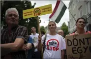  ?? DENES ERDOS — THE ASSOCIATED PRESS ?? Residents gather in Debrecen, Hungary, during a demonstrat­ion against a factory that will produce batteries for electric vehicles built by a China-based company, on Tuesday.