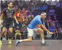  ?? Photo by Shihab ?? Karim Abdel Gawad (left) watches as Ali Farag plays a backhand drop shot on his way to a 11-5, 11-5 win. —