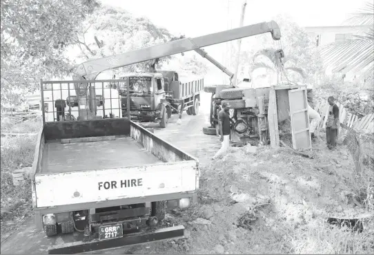  ??  ?? This truck turned over in E Field Sophia on Tuesday. It had been offloading dirt when it turned over.