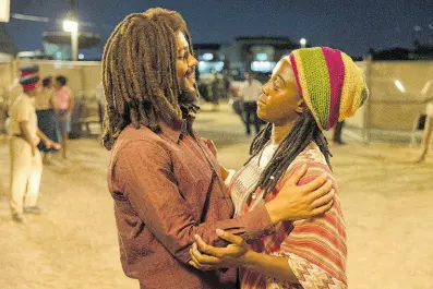  ?? AP PHOTOS ?? Kingsley Ben-Adir, who plays Marley left, and Lashana Lynch who takes on the role of his wife, Rita, in a scene from the biopic, ‘Bob Marley: One Love’.