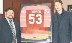  ?? PHOTO SUBMITTED BY THE CITY OF BATHURST ?? City of Bathurst Mayor Paolo Fongemie with Summerside native Noah Dobson during a special ceremony to retire his special Pink in the Rink, Acadie-Bathurst Titan jersey.
