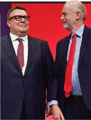  ??  ?? Unity memo: Deputy Tom Watson with Jeremy Corbyn at Labour conference in Liverpool