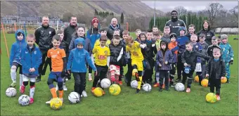  ?? Photograph­s: Iain Ferguson, alba.photos. ?? Keen youngsters and coaches braved the wind and rain for the primary school football training session at Claggan Park.