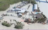  ?? WATER SURROUNDS GILBERT’S RESORT IN KEY LARGO, FLA., BY WILFREDO LEE, AP ??