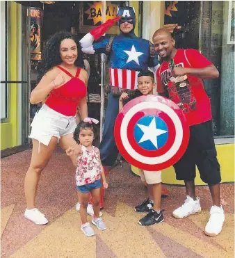  ??  ?? When the COVID-19 pandemic lockdown began, Ellie Safari of Windsor, Ont., and her American boyfriend, James Darden, shown with their children at Universal Studios Florida, faced a heartbreak­ing decision. Darden moved to Windsor, leaving his teenage daughter and mother in Detroit.