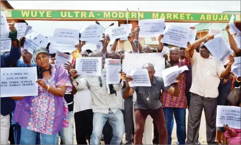 ??  ?? Market men and women, weekened at the Wuye Model Market, FCT, Abuja