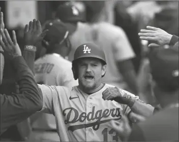  ?? CHARLES REX ARBOGAST/AP ?? LOS ANGELES DODGERS’ MAX MUNCY celebrates his three-run home run off Chicago White Sox relief pitcher Bennett Sousa during the sixth inning of a game Thursday in Chicago.