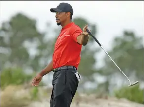  ?? Associated Press ?? Troubled Tiger: In this Dec. 4, 2016, file photo, Tiger Woods reacts after a putt during the final round at the Hero World Challenge golf tournament in Nassau, Bahamas. Police say golf great Tiger Woods has been arrested on a DUI charge in Florida. The...