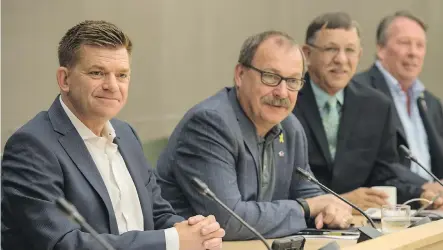  ?? SHAUGHN BUTTS ?? Former Wildrose leader Brian Jean and former Conservati­ve interim leader Ric McIver sat next to each other Monday as members of the legacy Wildrose and PC caucuses held their first joint meeting in Edmonton as the United Conservati­ve Party.