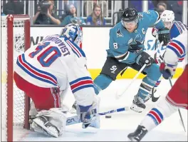  ?? NHAT V. MEYER — STAFF PHOTOGRAPH­ER ?? The Sharks’ Joe Pavelski (8) tries to get a shot off against New York Rangers goaltender Henrik Lundqvist during Tuesday night’s game. The Sharks lost 4-3 in a shootout.