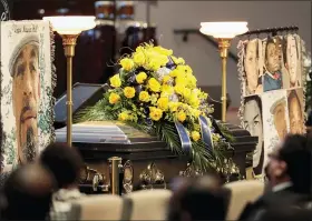  ?? JOSHUA A. BICKEL — THE COLUMBUS DISPATCH VIA AP ?? Flowers and blankets are placed near the casket of Andre Hill during his funeral on Tuesday, Jan. 5, 2021at First Church of God in Columbus, Ohio. A white Ohio police officer was indicted Wednesday, Feb. 3, 2021on murder charges in the December shooting death of 47-year-old Andre Hill. Columbus Police Officer Adam Coy was indicted by a Franklin County grand jury on Wednesday following an investigat­ion by the investigat­ion division of the Ohio Attorney General’s office.