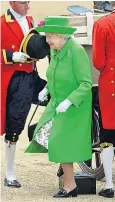  ??  ?? The Queen’s neon green outfit fulfilled her mantra of being seen to be believed and remaining visible to everybody