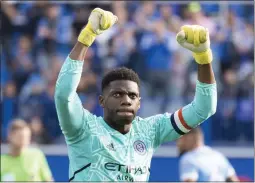  ?? PAUL CHIASSON — THE CANADIAN PRESS, FILE ?? New York City goalkeeper Sean Johnson celebrates his team’s victory over CF Montreal in the Eastern Conference semifinals on Oct. 23in Montreal.