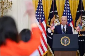  ?? Evan Vucci The Associated Press ?? President Joe Biden, in his first formal news conference Thursday, discussed immigratio­n, the Senate filibuster and gun control and said he plans to run for re-election.