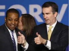  ?? WIN MCNAMEE/GETTY IMAGES ?? Ralph Northam, right, with Lt.-Gov.-elect Justin Fairfax, won Virginia’s gubernator­ial election by a landslide against a pro-Trump Republican.