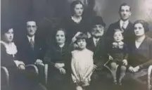  ??  ?? ABOVE Cohn’s mother, Helen Edel, as a girl (in white dress), surrounded by her family, circa 1930. She and her uncle Herman, second from left, would be the only ones to survive the Holocaust.
LEFT Helen as a young woman in Poland after the war.